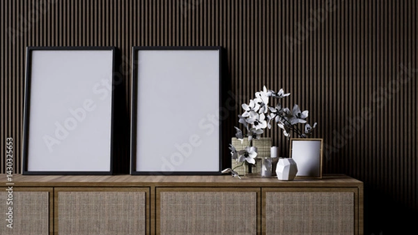 Obraz A modern interior scene featuring a wooden console with empty frames and decorative flowers against a textured wall.