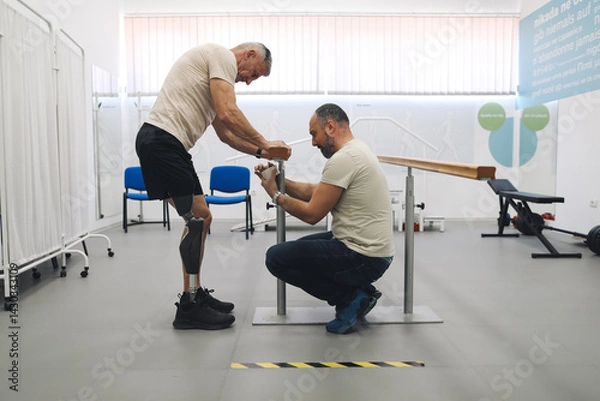 Fototapeta Prosthetist and an amputee collaborate during a personalized prosthetic fitting session