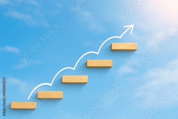 Fototapeta Ascending to Success: A path of five wooden blocks ascending against a blue sky with a white drawn arrow reaching for the heavens. The perfect image for representing growth.