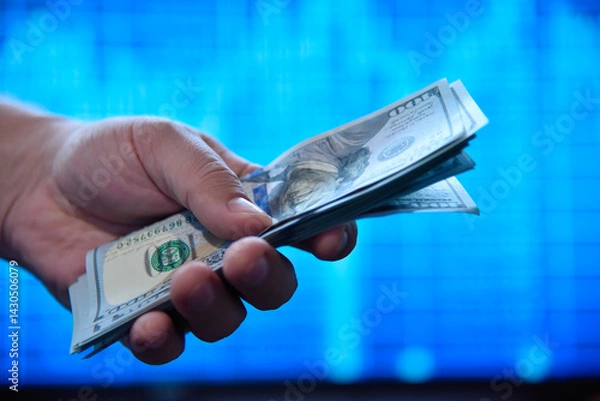 Obraz Hands holding and counting dollar banknotes