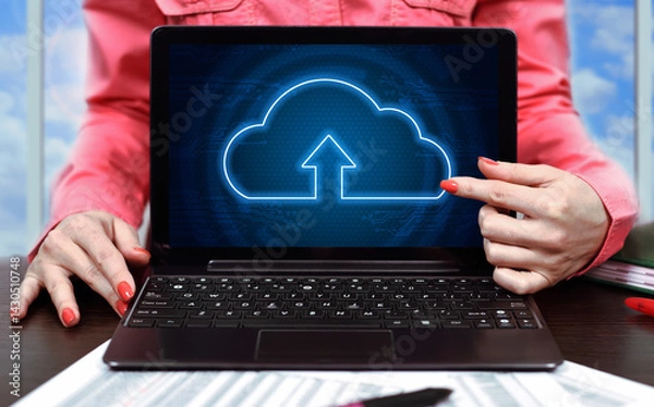 Obraz Businesswoman in office and laptop with cloud computing interface.