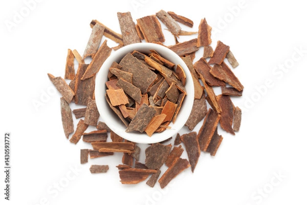 Obraz A bowl of Organic Cinnamon sticks (Cinnamomum verum), placed over a heap of Cinnamon sticks. Isolated on a white background.