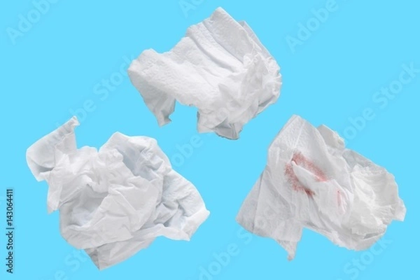 Fototapeta Piece paper tissue white isolated on blue background with clipping path.