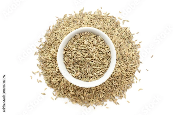 Obraz A bowl of Organic Fennel Seeds (Foeniculum vulgare) Badi saunf, placed over a heap of whole  Fennel Seeds. Isolated on a white background.