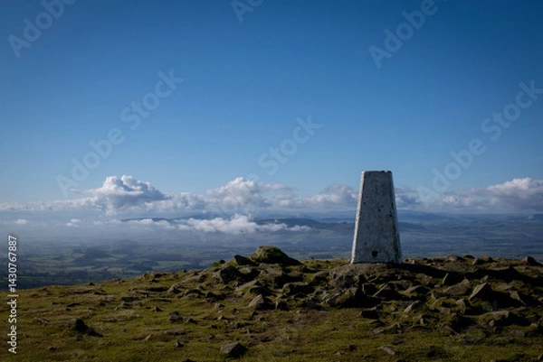 Obraz a view of the beacon at the top of Clee hill with the mist on the ground bellow
