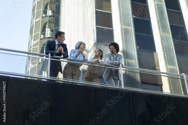 Obraz Business people talking on balcony of modern office building