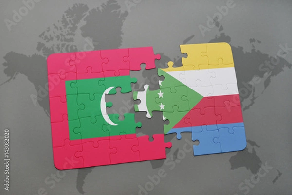 Fototapeta puzzle with the national flag of maldives and comoros on a world map