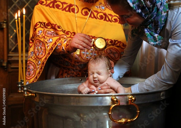 Fototapeta Rite of baptism in the Orthodox Church