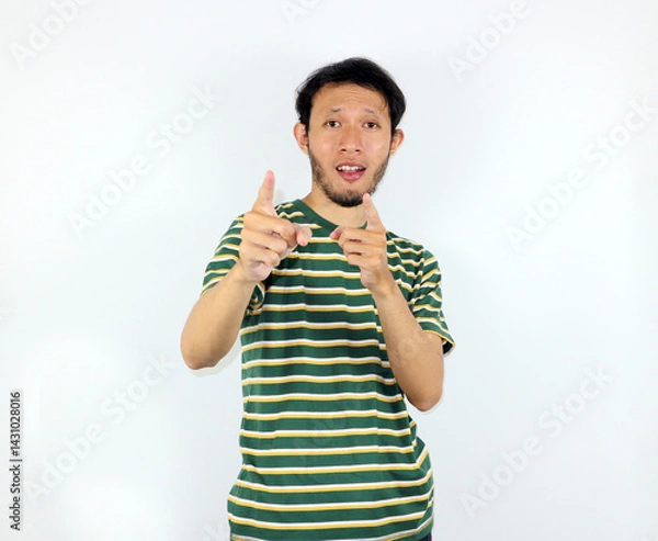 Fototapeta Man Pointing Fingers with Positive Expression on White Studio Background