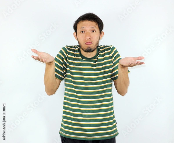 Fototapeta Man Shrugging Shoulders with Questioning Expression on Plain White Background