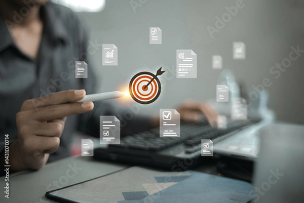 Obraz A stylus pointing at a target icon surrounded by floating document icons, implying document management or focused strategy.