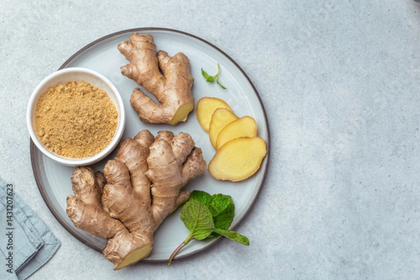 Obraz sliced fresh ginger root,  ginger powder and mint leaves