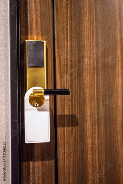 Fototapeta  Empty blank white sign tag door on hanger the hotel room electronic card key door lock with Wooden oak door background