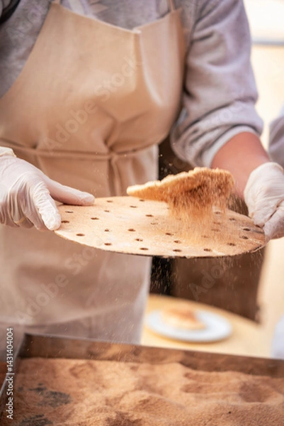 Obraz Photo from Hurghada in Egypt showing woman making Egyptian bread