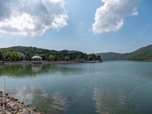 Fototapeta Picturesque view of embankment of lake Abrau on sunny day in Abrau Durso