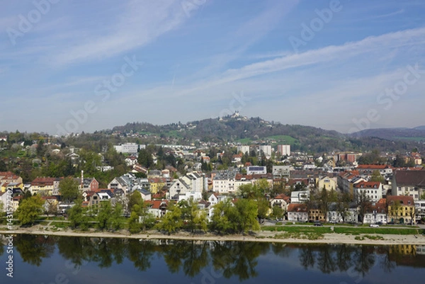 Fototapeta A riverside embankment in Linz, the river Danube, Austria       