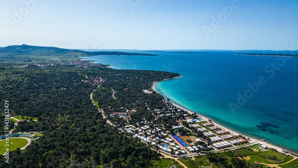 Obraz Aerial view of Novalja on Pag Island, Croatia. Famous for its beaches, vibrant summer atmosphere, and scenic Adriatic coastline. Captured by drone for a stunning panoramic perspective