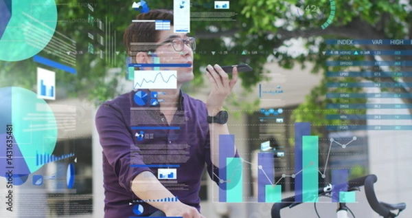 Fototapeta Image of asian businessman talking on smartphone over data processing