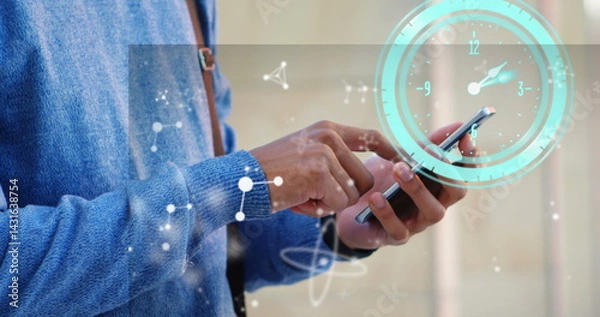 Obraz Image of clock moving over biracial businessman using smartphone