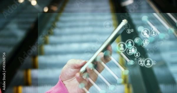 Obraz Image of media icons and dna strand over biracial businesswoman using smartphone