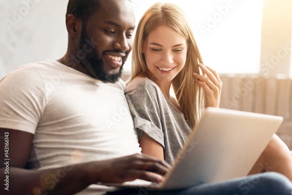 Obraz Peaceful international couple relaxing at home
