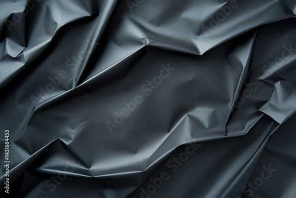 Obraz Crumpled dark black fabric texture creates dramatic and moody atmosphere, perfect for backgrounds or artistic projects. intricate folds add depth and interest to any design