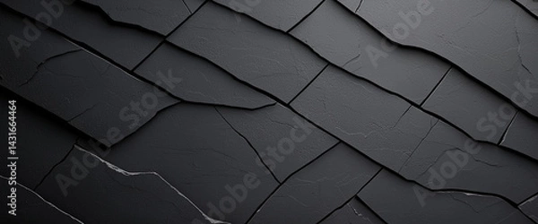 Obraz textured black surface with cracked patterns, showcasing dark gray concrete appearance that evokes sense of depth and intrigue. design is modern and artistic, perfect for backgrounds