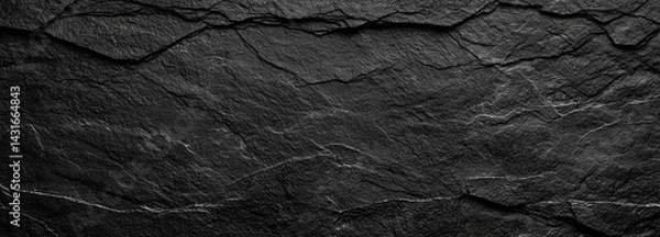 Obraz textured black background featuring dark gray rough stone with intricate cracks and lines, creating dramatic and moody atmosphere. This is perfect for various design projects