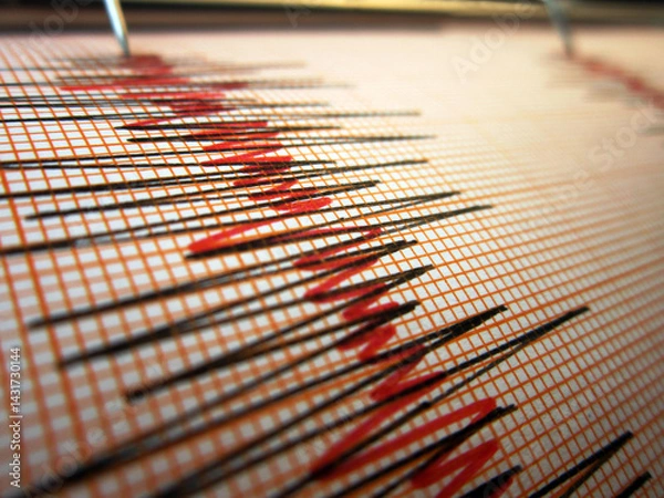 Fototapeta Seismograph and earthquake. A seismograph that records the seismic activity of an earthquake.