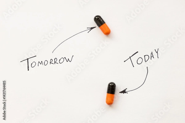 Fototapeta Two pills are on a white background with the words tomorrow