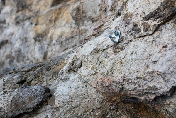 Fototapeta A rock with a silver bolt on it
