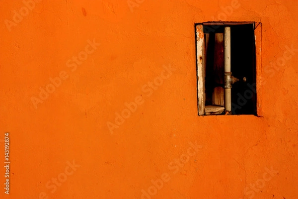 Fototapeta orange wall with water tube