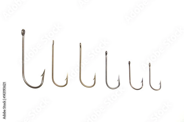 Obraz Рыболовные крючки на белом фоне крупным планом 