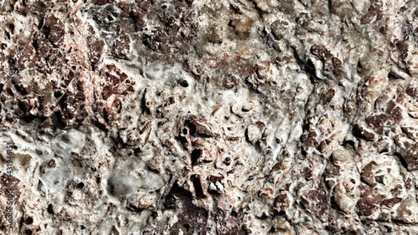 Fototapeta Textured surface of natural stone with intricate patterns and earthy tones showcasing geological formations and unique mineral deposits, abstract background