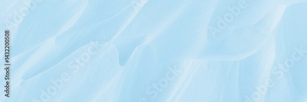 Fototapeta Snow texture. Wind sculpted patterns on snow surface. Wind in the tundra and in the mountains on the surface of the snow sculpts patterns and ridges (sastrugi). Arctic, Polar region. Winter background