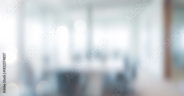Fototapeta Blurred office interior with chairs and table creating an abstract bright background. Professional photos for backgrounds for text, banners, posters, and web displays.