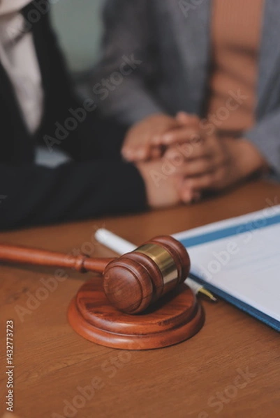 Obraz Judge gavel with Justice lawyers having team meeting at law firm background. Concepts of Law and Legal services.
