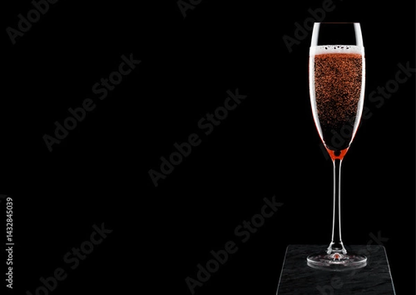 Obraz Elegant glass of pink rose champagne with bubbles on blavk marble board on black background. Space for text