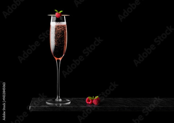 Obraz Elegant glass of pink rose champagne with raspberry on stick with fresh berries and mint leaf on black marble board on black background.Space for text