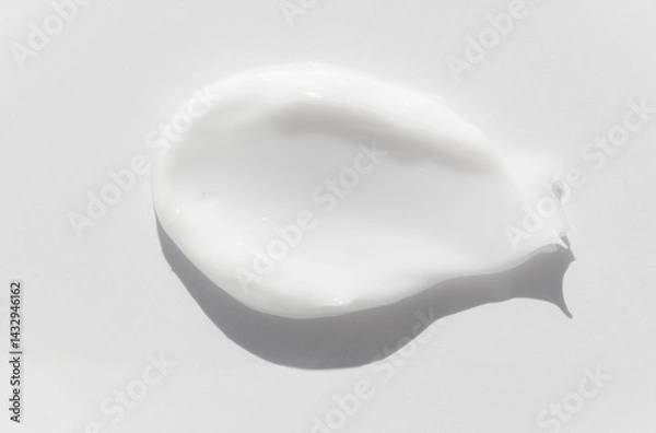 Fototapeta Smear sample of cosmetic cream, lotion, soap on a white background, top view, macro.