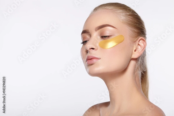 Fototapeta Portrait of girl with a gold patch under the eye.