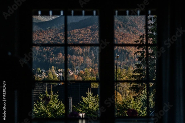 Obraz Horizontal window frame view to the chalet, forest and mountains at sunset. Autumn mountain landscape in Zakopane, Poland.