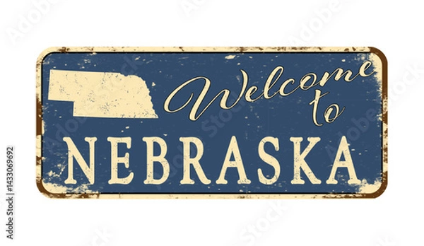 Fototapeta Welcome to Nebraska. A worn blue plaque with the name and outline of the state. Welcome inscription on the road sign