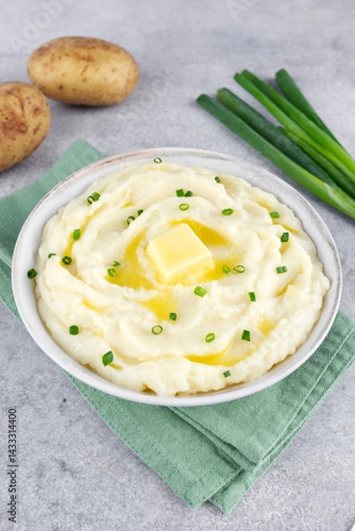 Obraz Mashed potatoes with melted butter and chopped green onions on a gray background. Irish mashed potatoes champ.