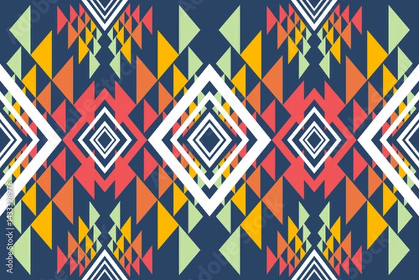 Fototapeta An abstract tribal pattern features vibrant triangles and diamonds arranged symmetrically against a deep blue background for textile design purposes.