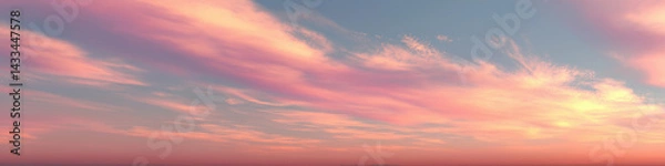 Obraz Soft pink clouds stretch across a peaceful sunset sky