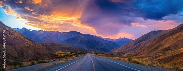 Obraz Vibrant sunset illuminates winding road through mountainous terrain