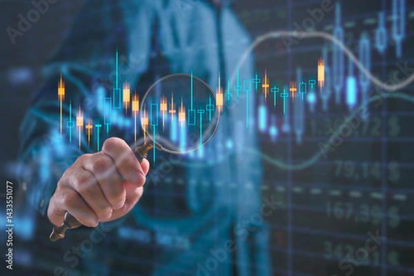 Obraz Businessman holding magnifying glass with stock chart in concept of Investment finance chart, stock market business and exchange financial growth graph