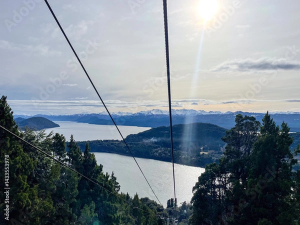 Fototapeta Beautiful range of snowy mountains and a lake with blue sky above in Bariloche Argentina, amazing panoramic view at Circuito Chico Patagonia.