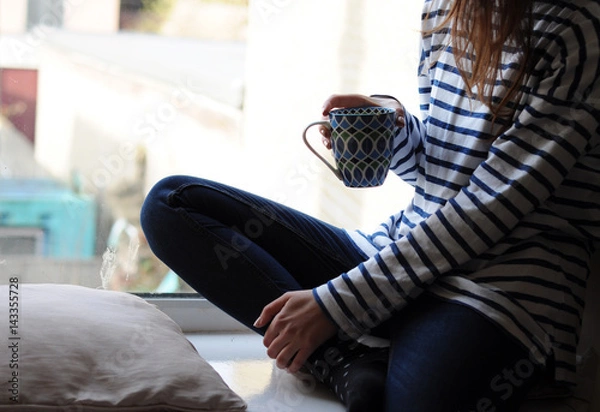 Fototapeta Sitting in a window